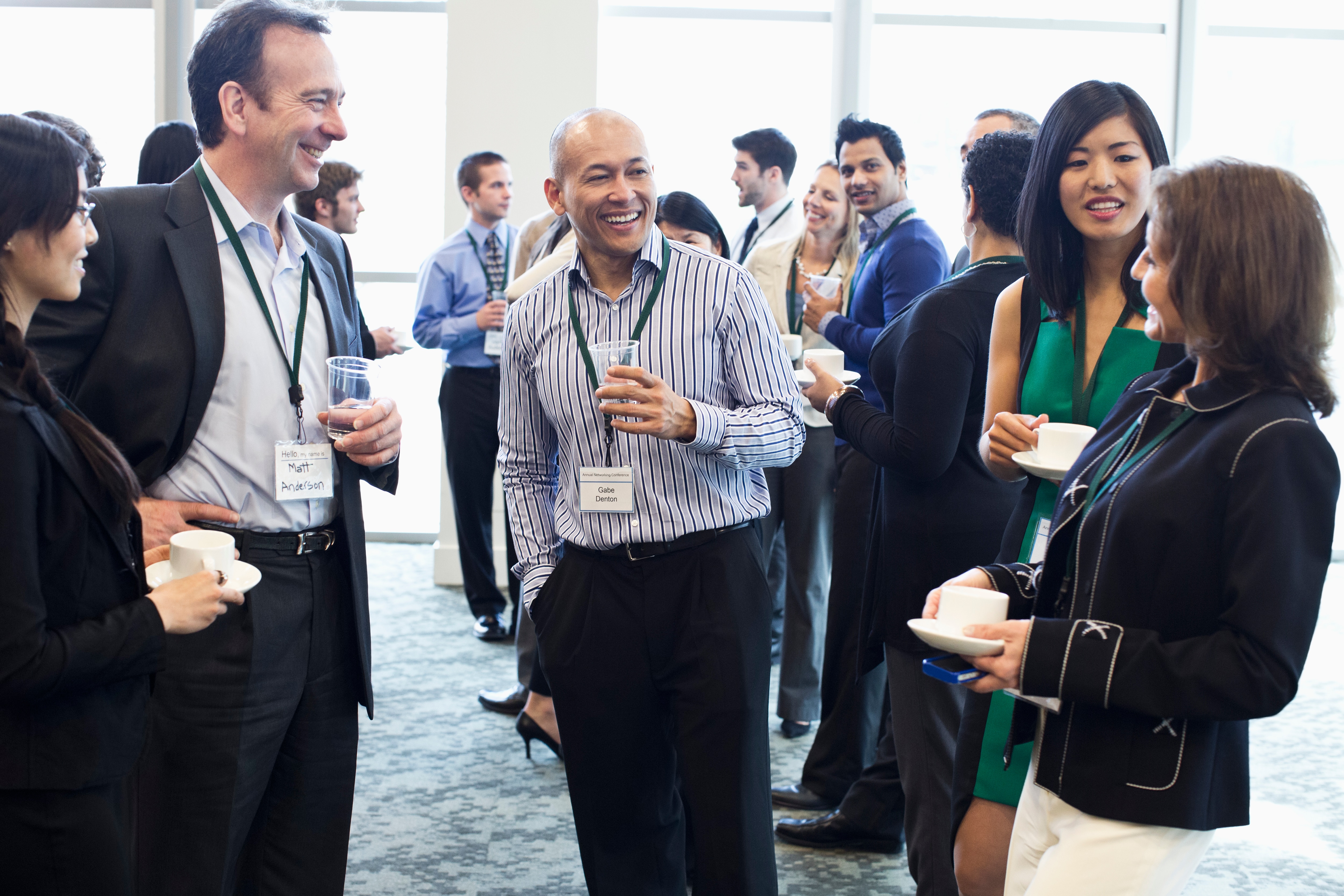 Group of people chatting at a corporate event