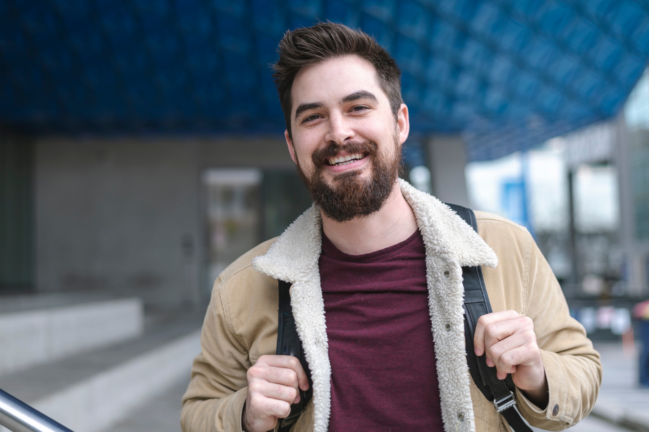 Man with a backpack on smiling 