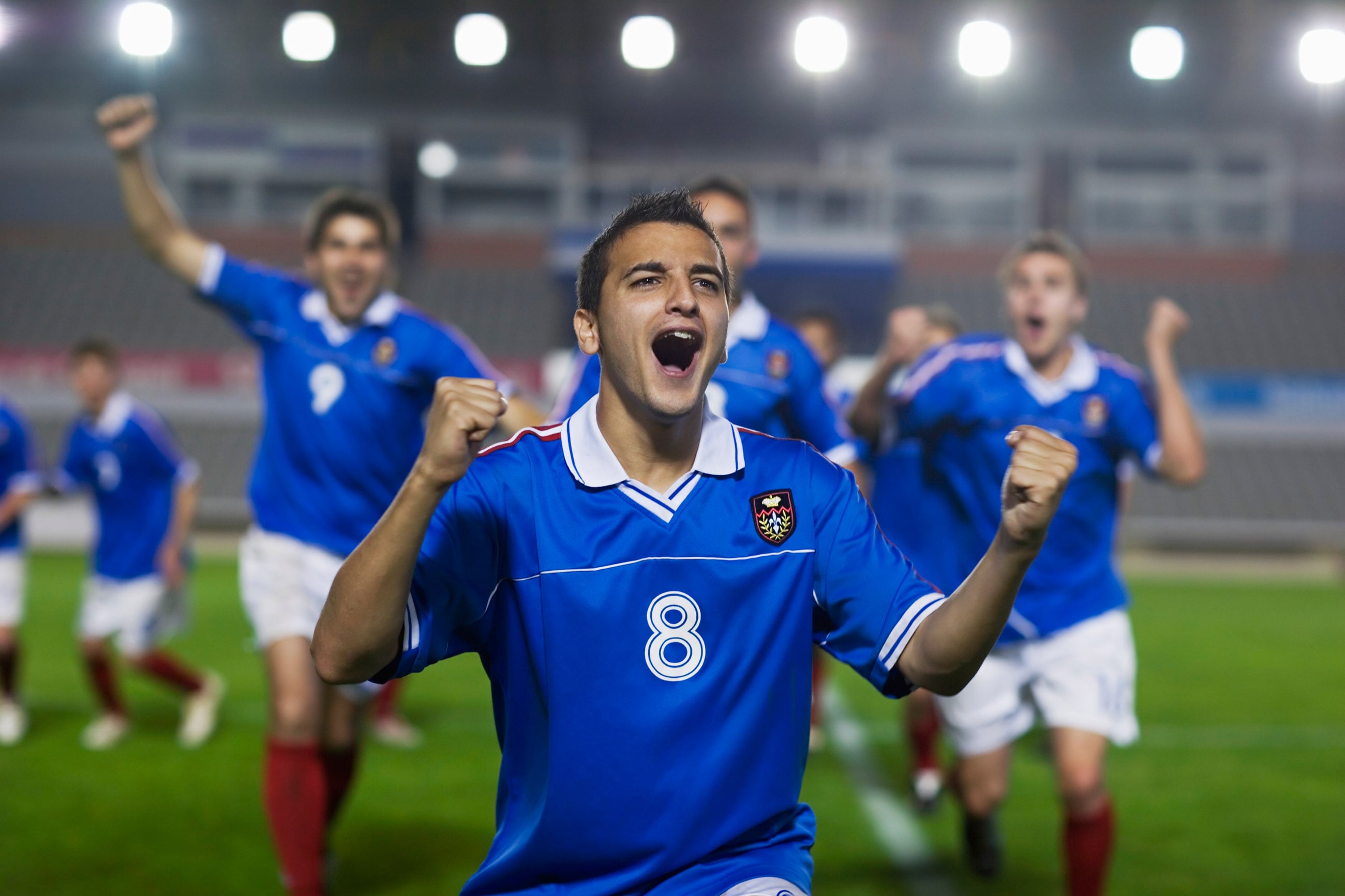 soccer players celebrating win