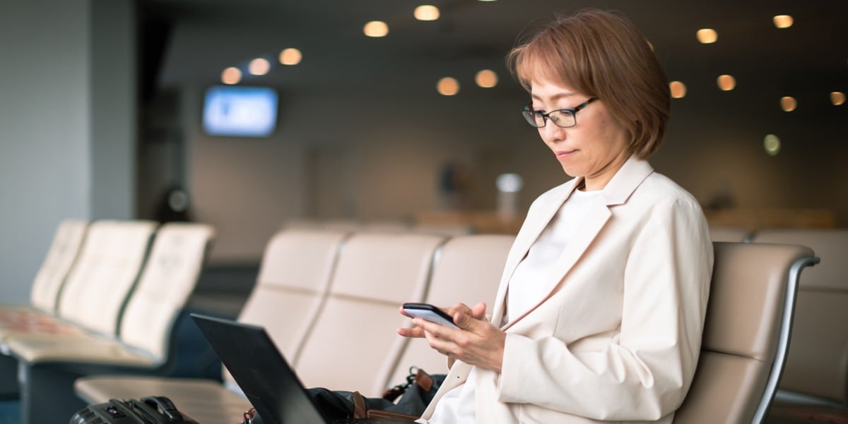 a woman at the airport boarding area