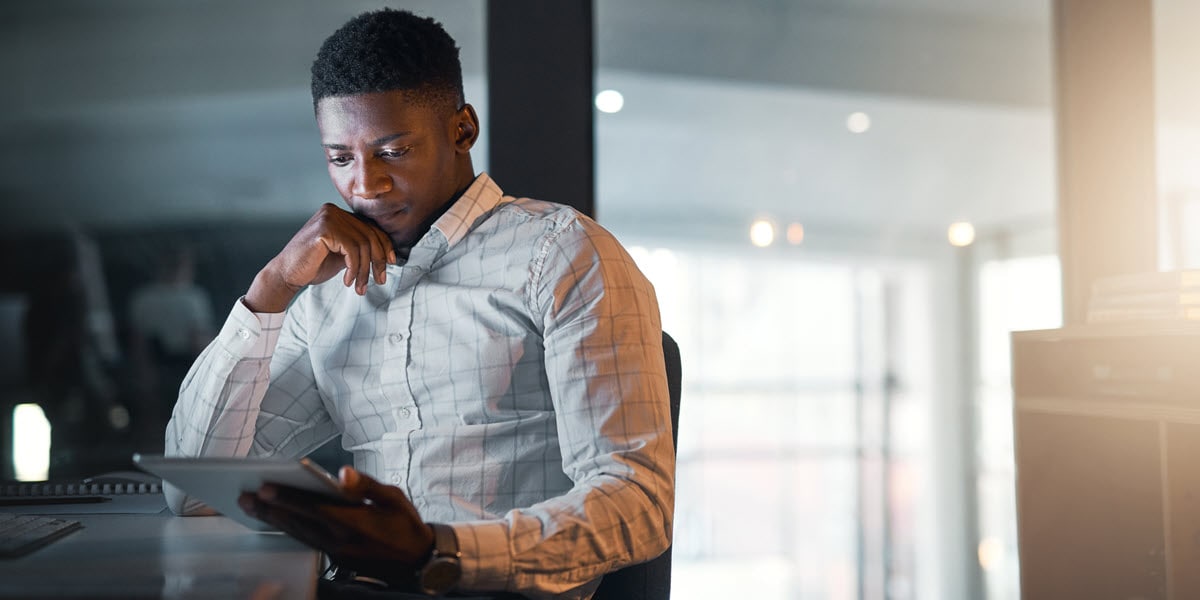 Man looking at tablet