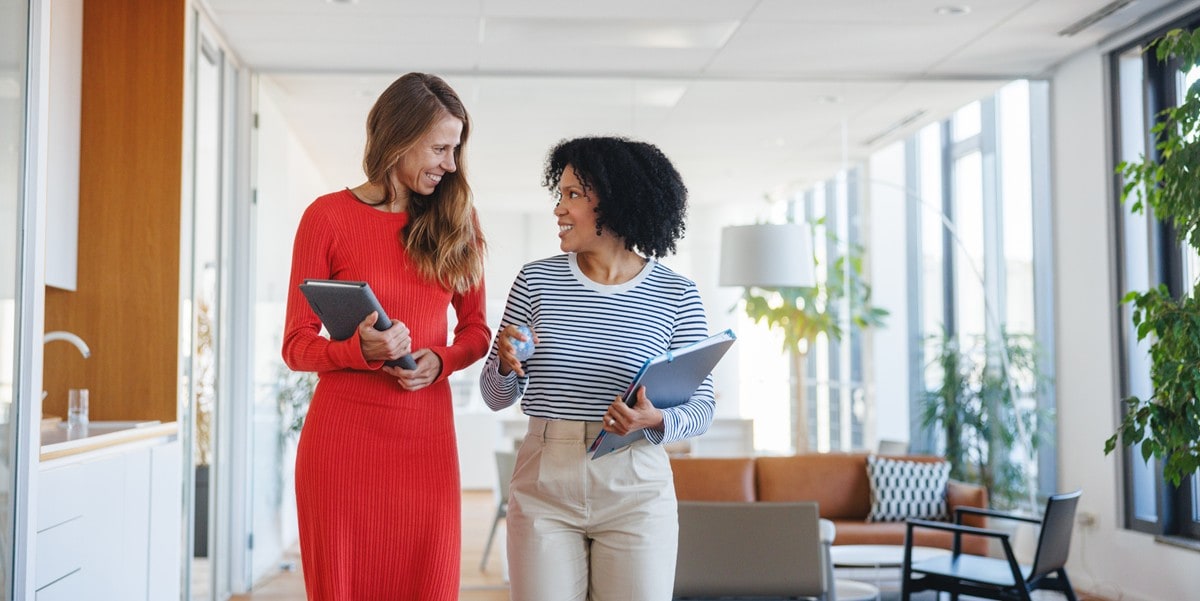 Two women collaborating in office