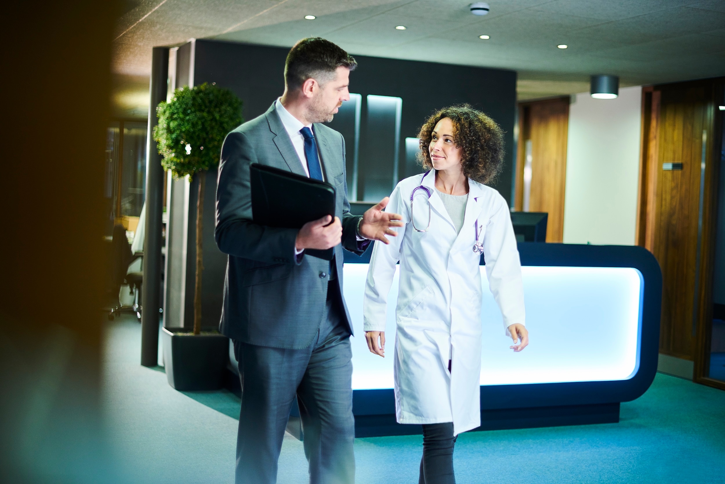 woman doctor and man in suit