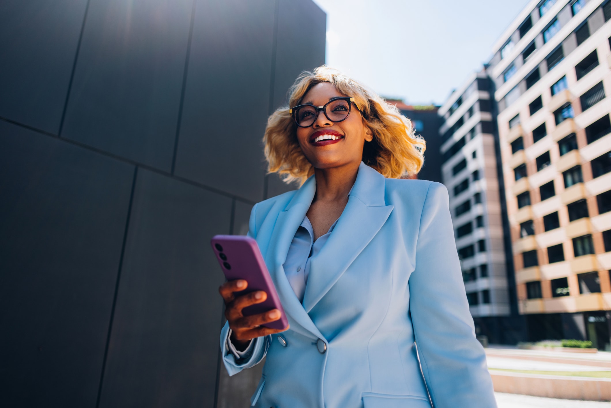 business woman smiling and walking to work