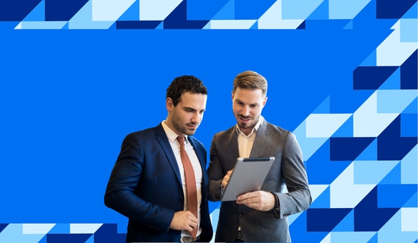 two men looking at tablet