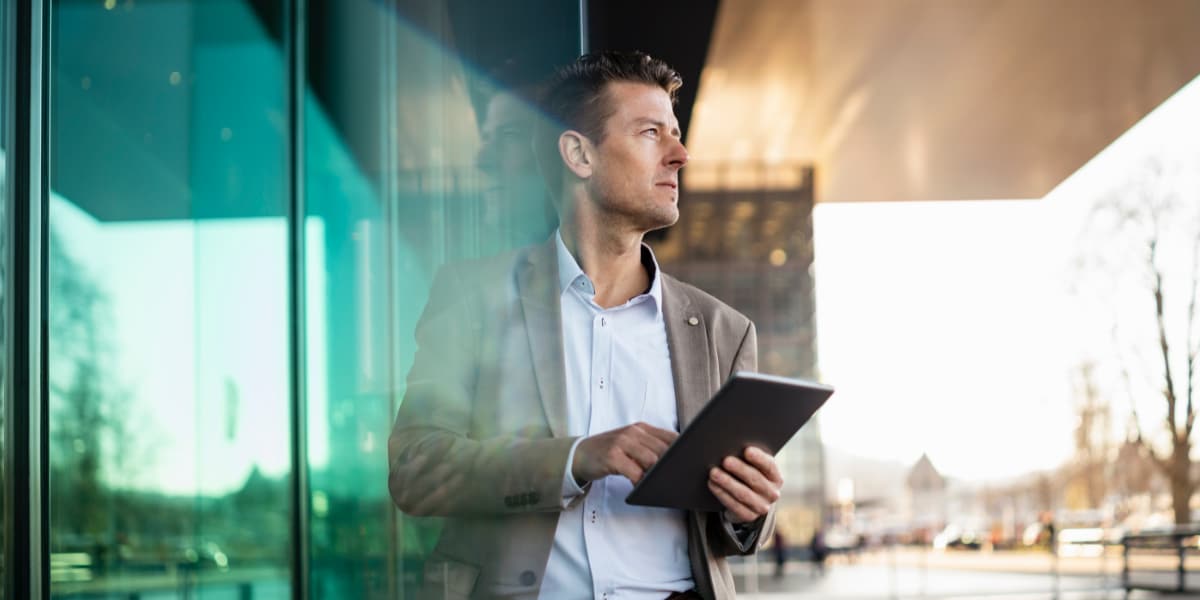 a finance leaders holding a tablet 