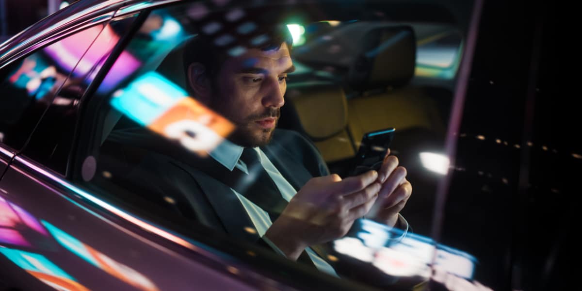 a business traveler using mobile to booking a trip