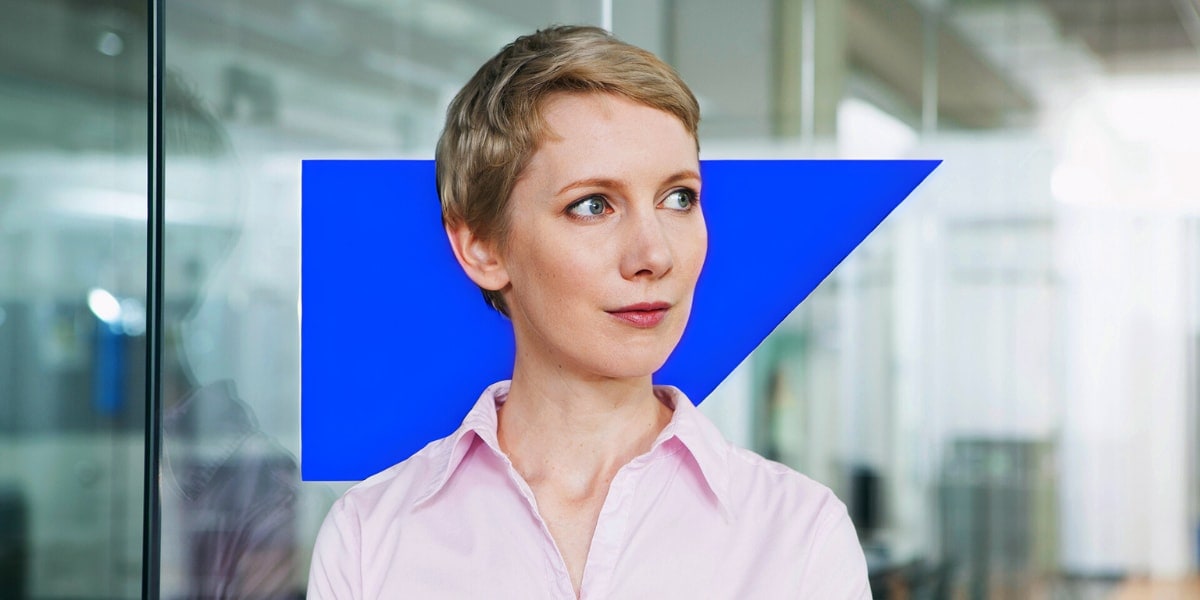 Woman in workplace looking out window