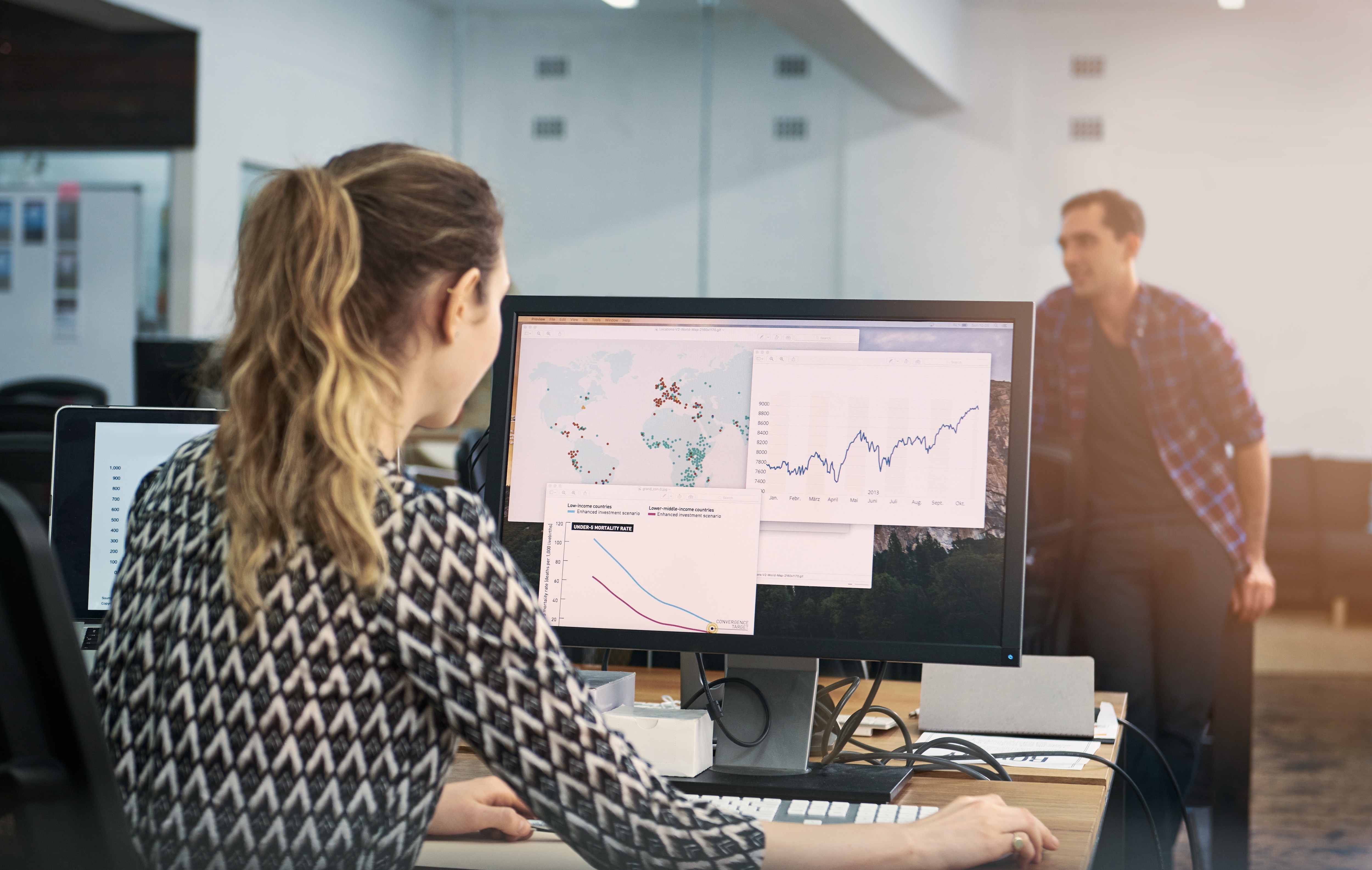 lady looking at reports from SAP concur