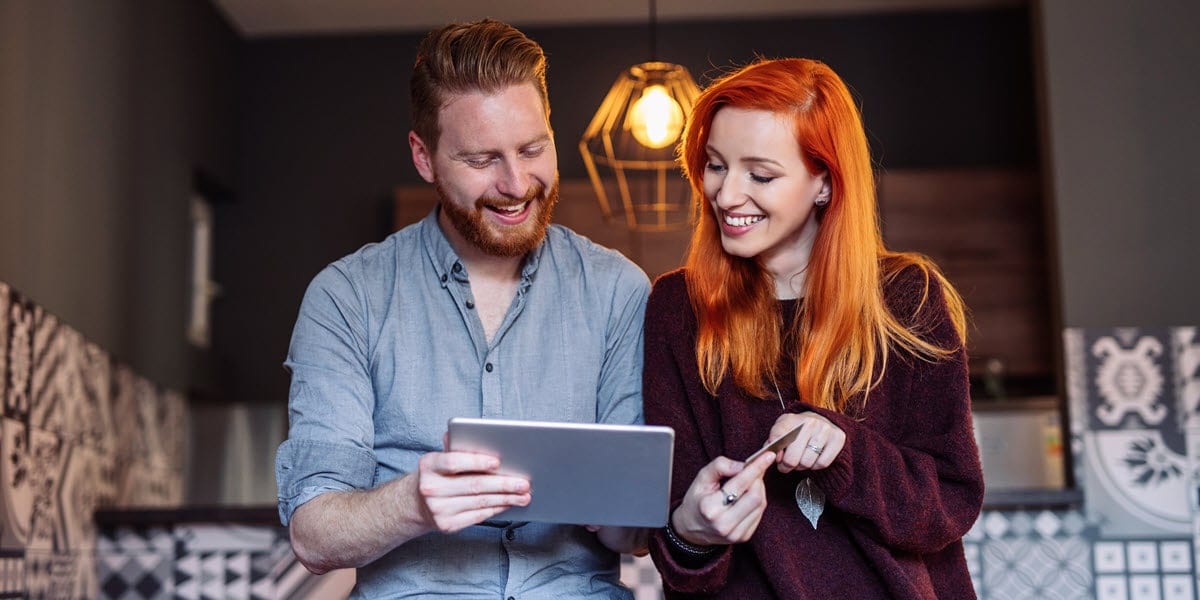 two young professionals looking at a tablet