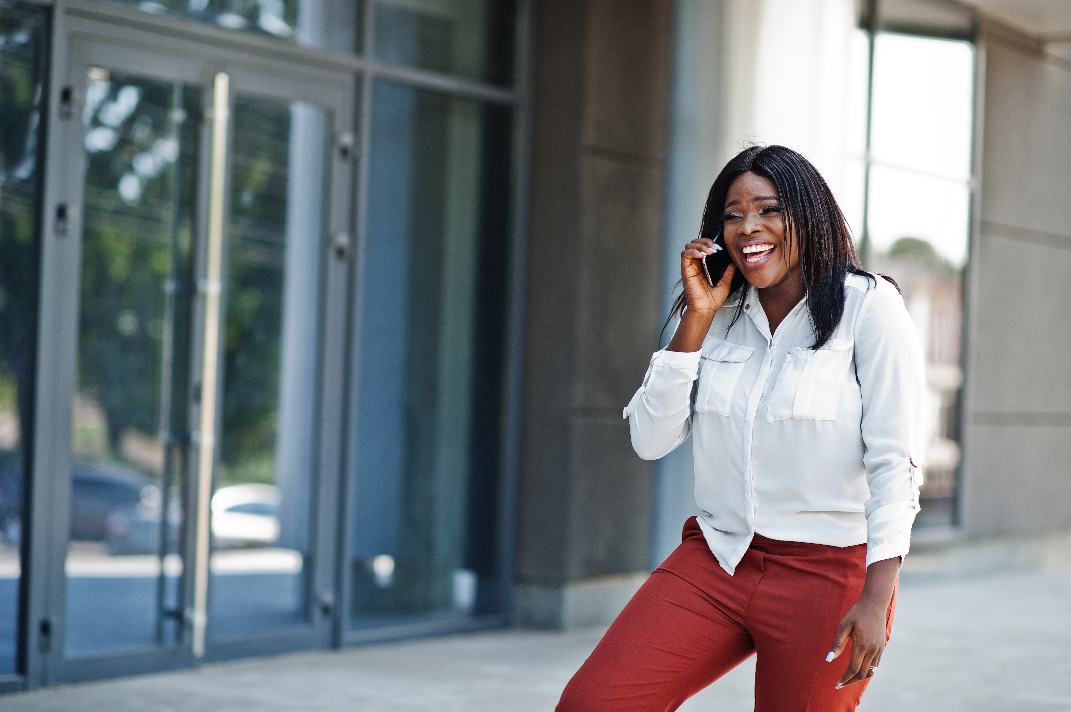 Woman smiling while on phone