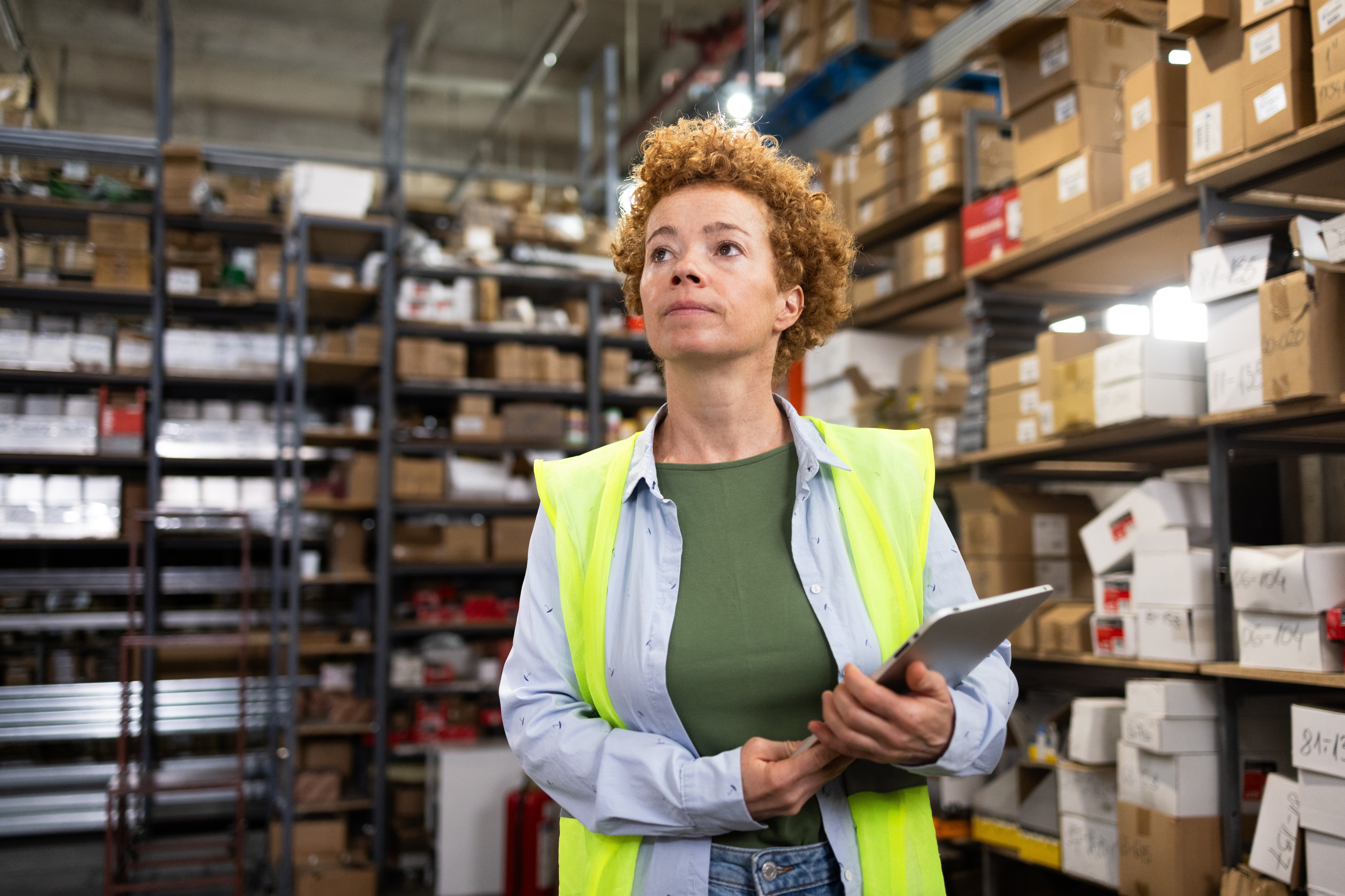 Three people walking with a computer talking