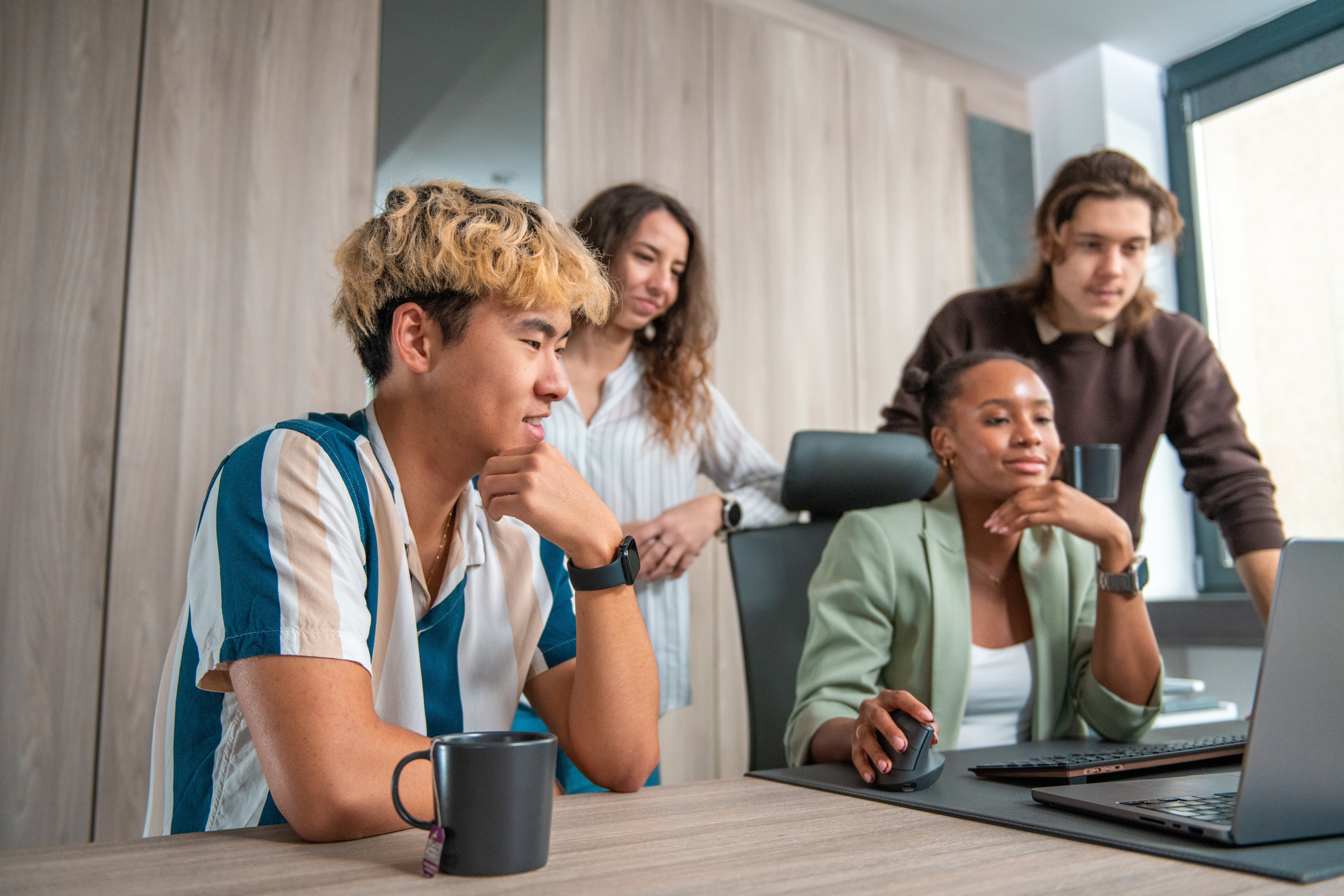 Reporting team looking at their spend data in office