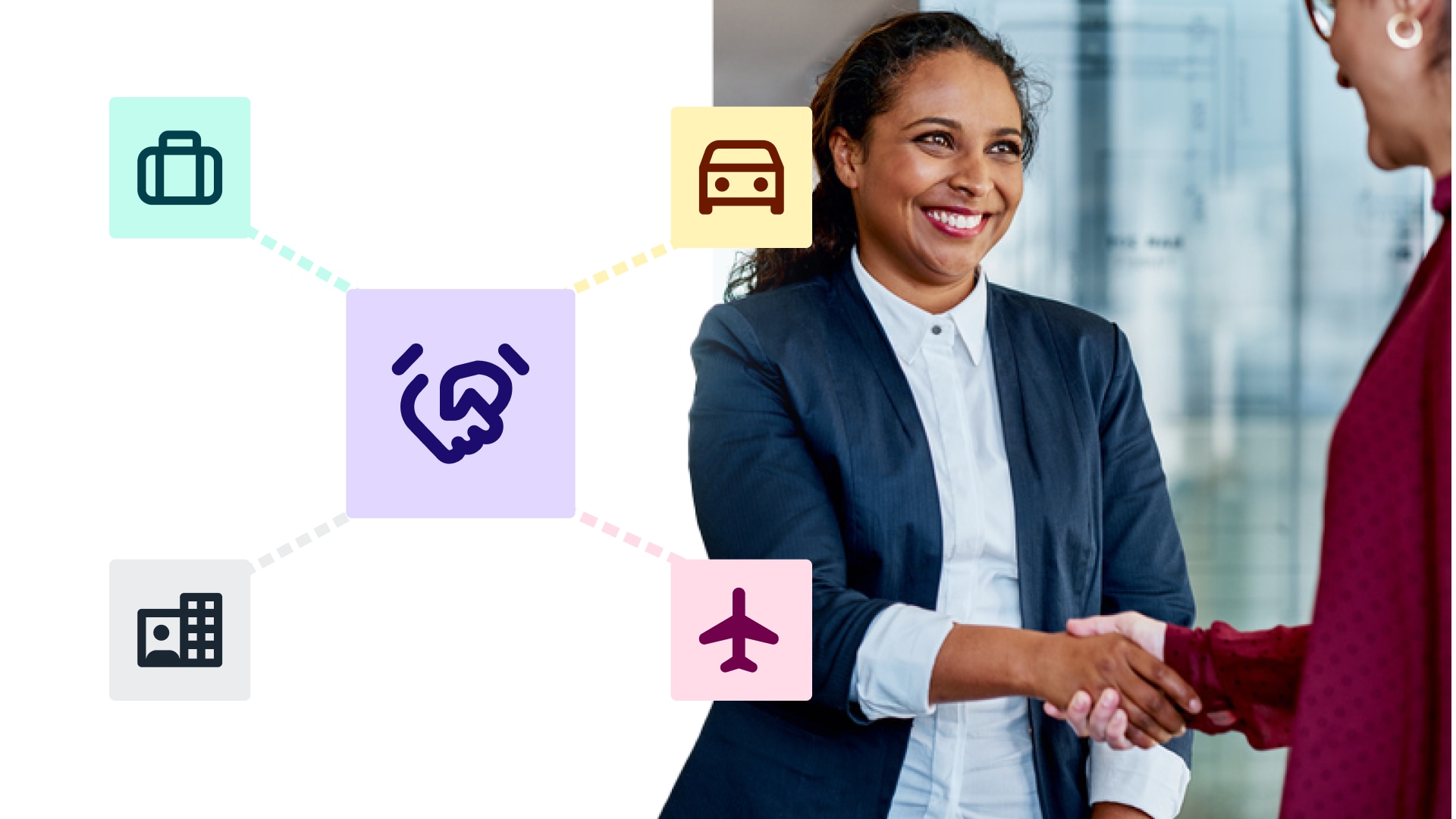 woman shaking hands with partner in office