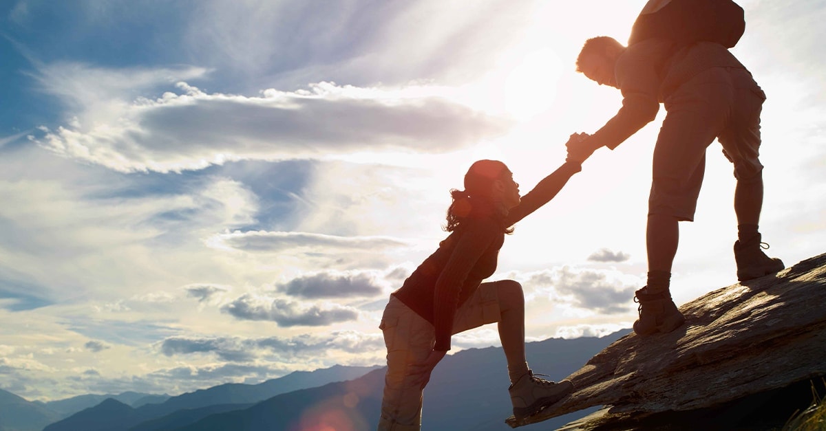 two-people-climbing-mountain
