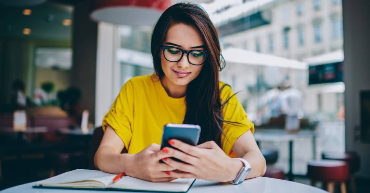 young woman blogger in spectacles