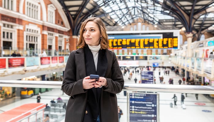 Woman waiting in train station