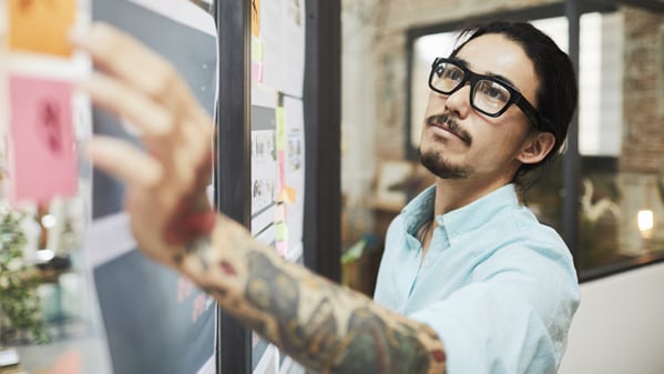 man working on whiteboard
