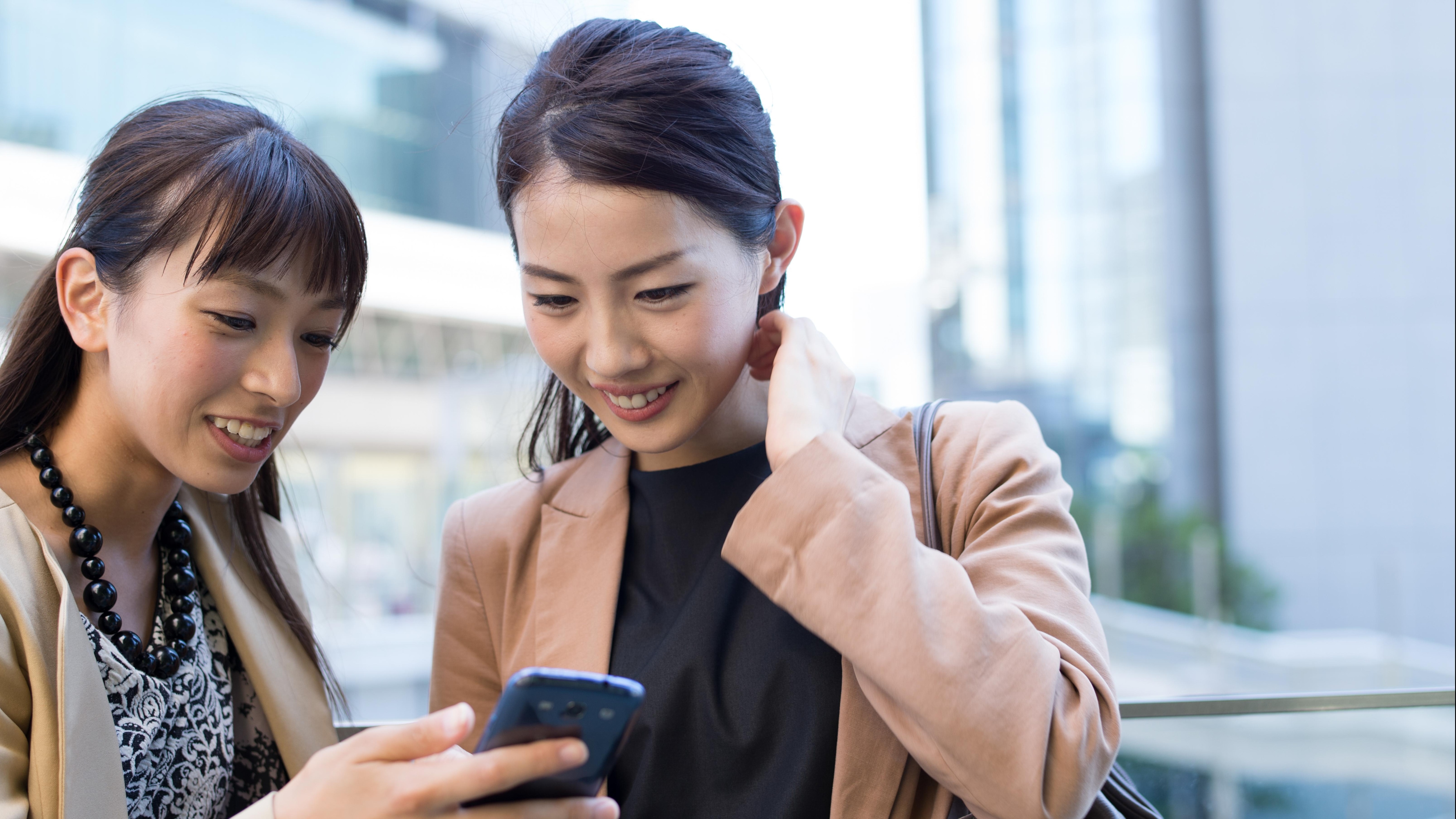 two people looking at the app