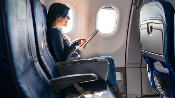 Business professional in airplane seat