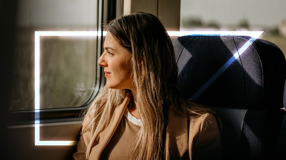 woman looking out window