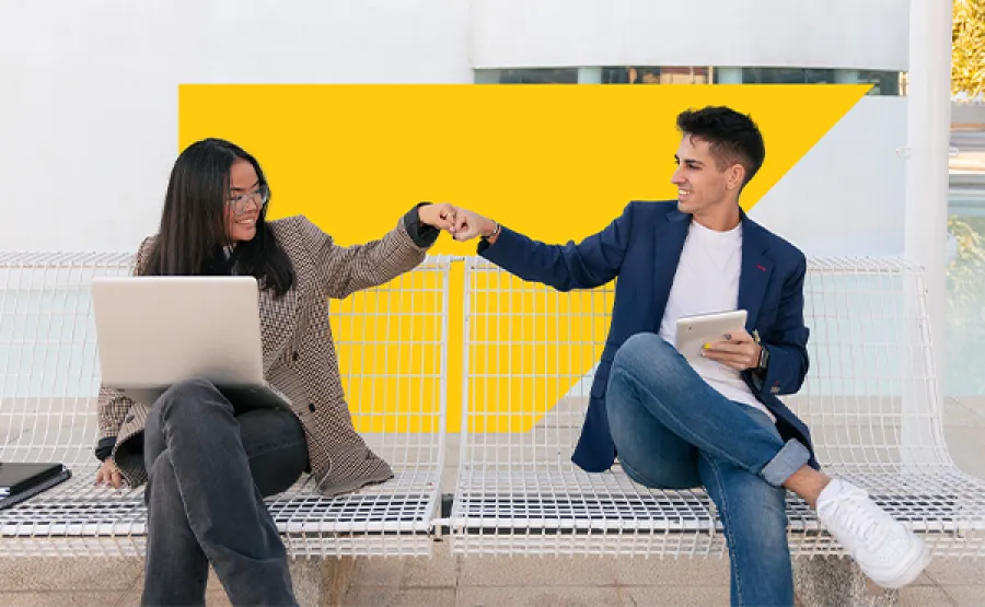 coworkers fist bumping in office