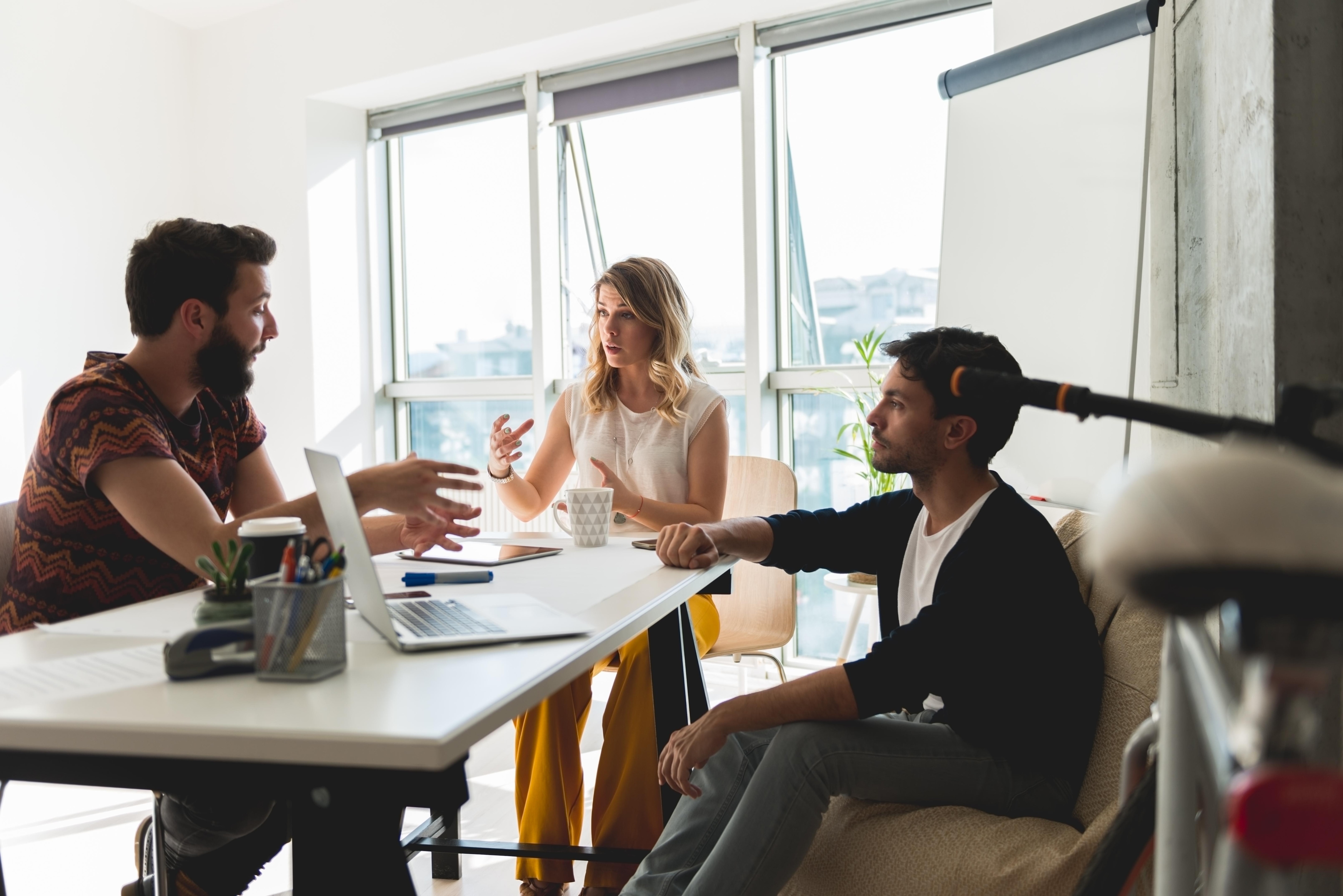 team of three working in office