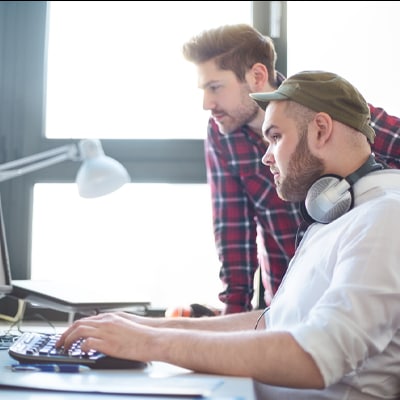 two people working on a computer