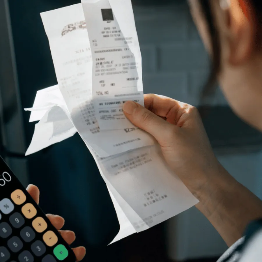 woman looking at receipts