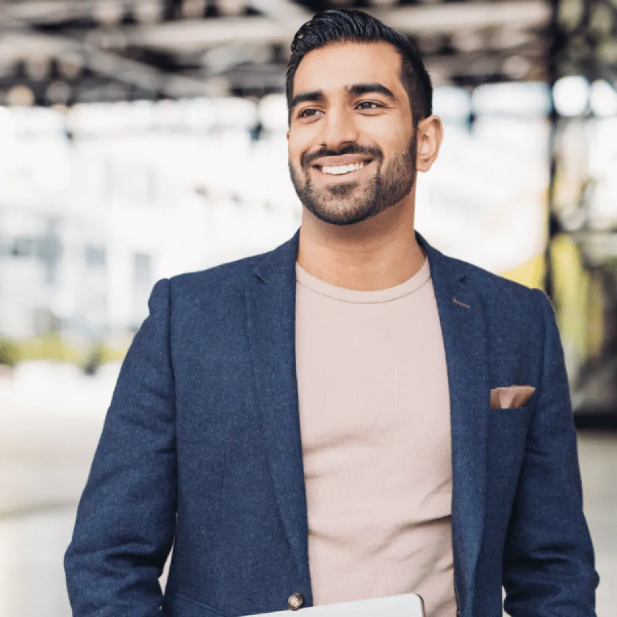 man in blazer smiling