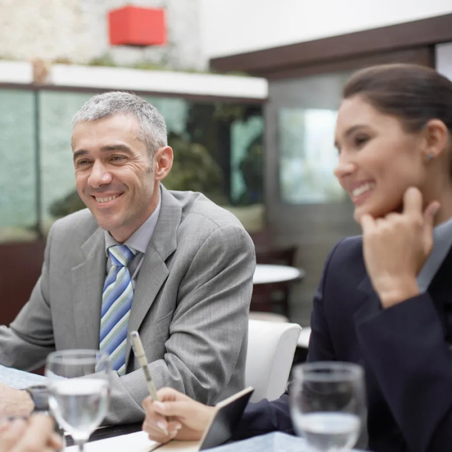 Business people sitting at table