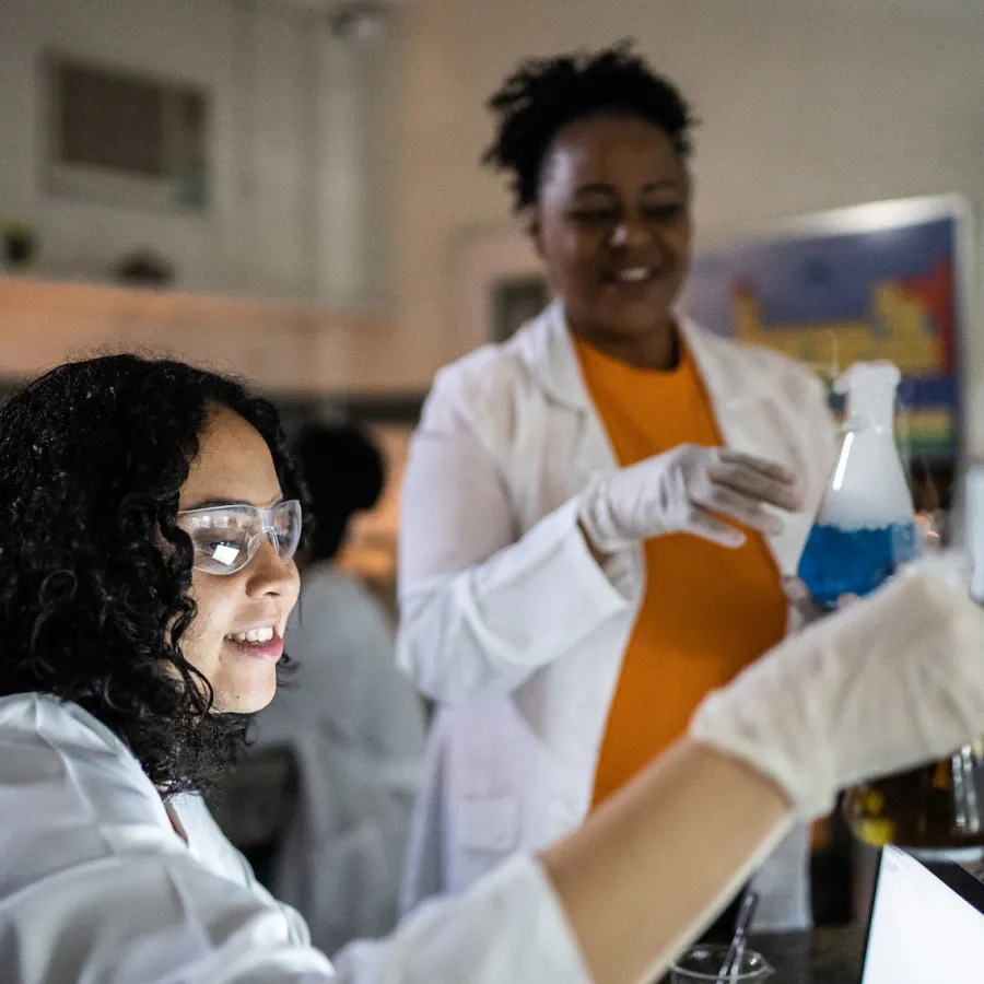 Kid experimenting in school with science project