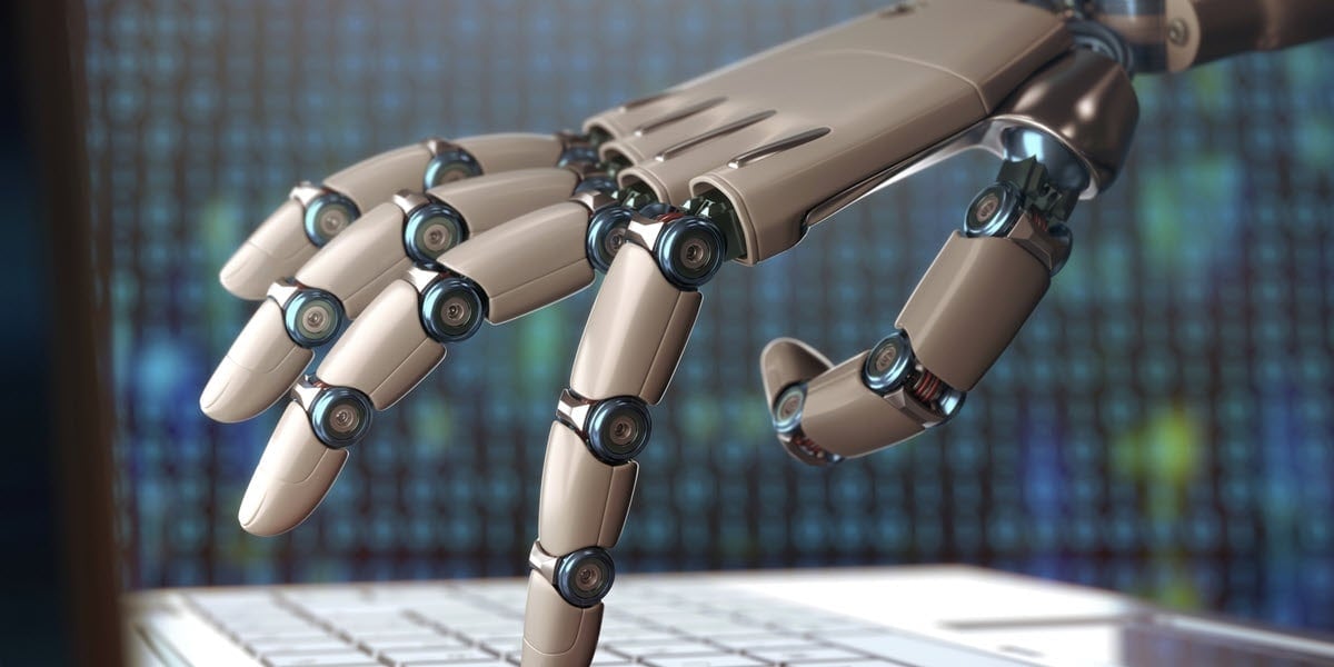 Robot hand on keyboard