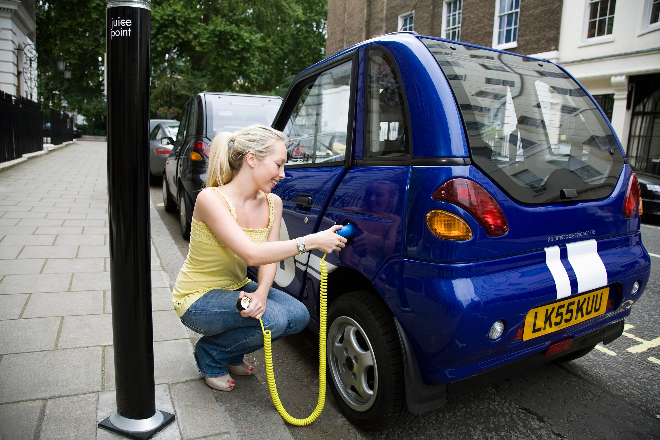 person-charging-electric-car